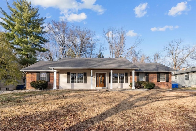 single story home featuring brick siding