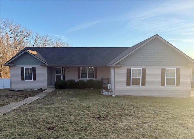 ranch-style house with a front lawn