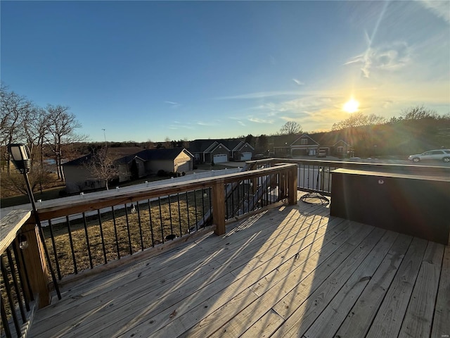 wooden terrace featuring a residential view