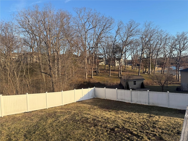 view of yard with a fenced backyard