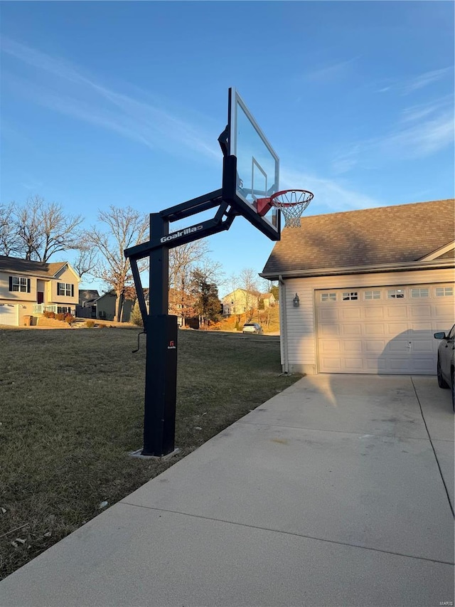 view of basketball court featuring a yard