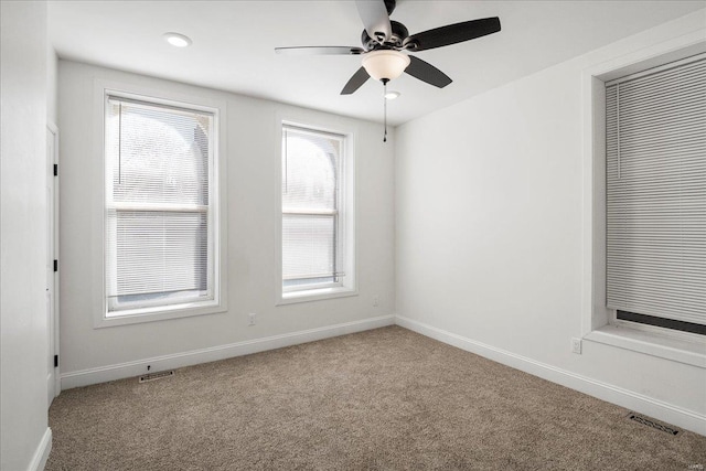 unfurnished room featuring recessed lighting, carpet, visible vents, and baseboards