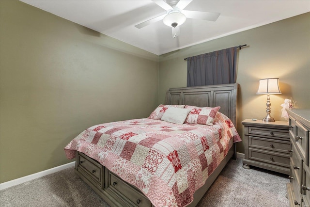 bedroom with ceiling fan, carpet, and baseboards