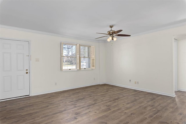 interior space with dark wood-style floors, ceiling fan, baseboards, and ornamental molding