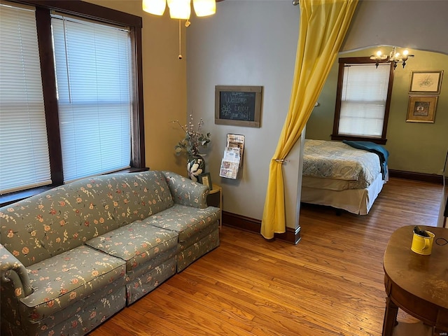 living room with baseboards and wood finished floors