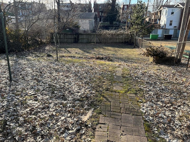 view of yard with fence and a residential view