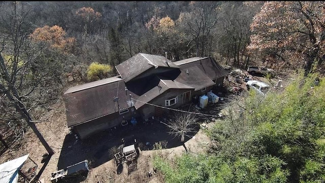 aerial view featuring a wooded view