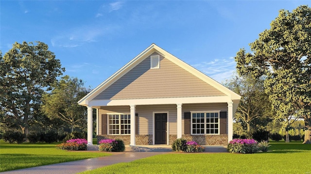 view of front of house with covered porch, brick siding, and a front yard