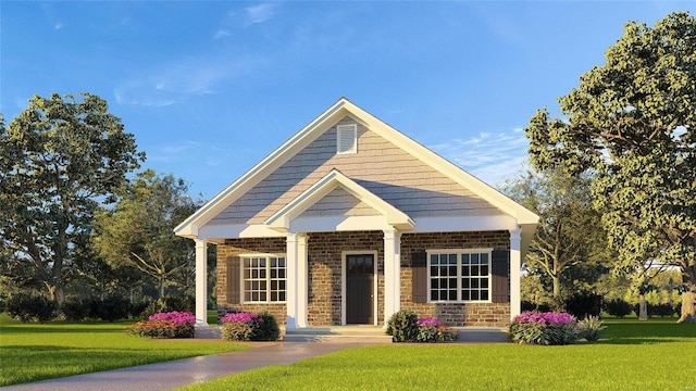 view of front of property featuring stone siding, brick siding, and a front yard