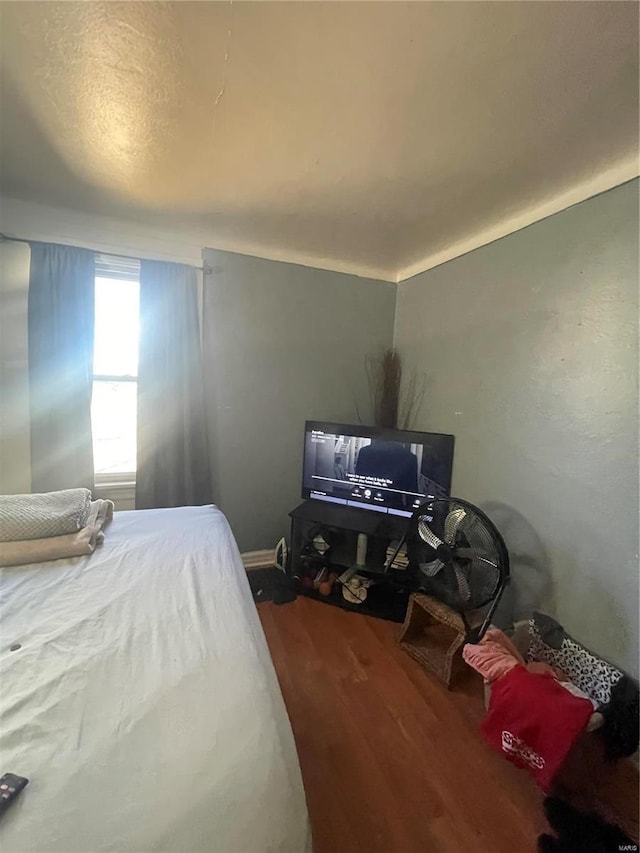 bedroom with wood finished floors