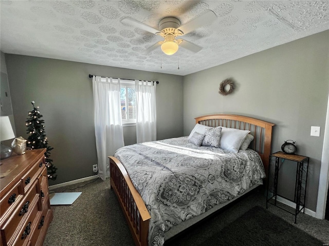 bedroom featuring a ceiling fan, carpet, baseboards, and a textured ceiling