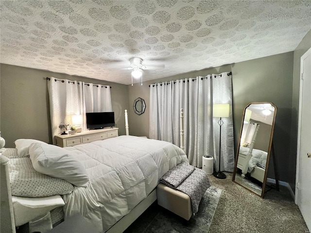 bedroom featuring carpet floors, ceiling fan, and a textured ceiling