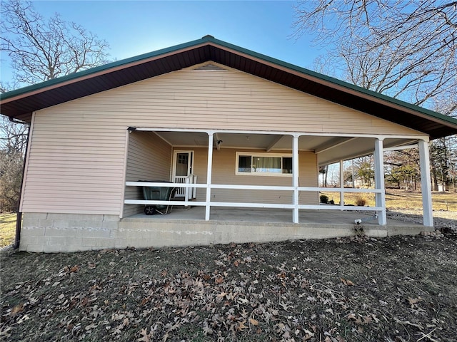 back of house with a patio