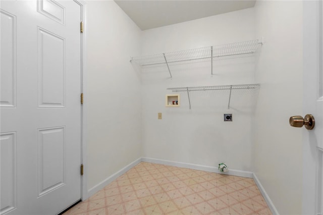 laundry area featuring laundry area, light floors, hookup for a washing machine, and electric dryer hookup