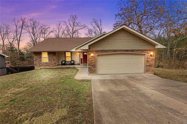 ranch-style home with a garage, covered porch, stone siding, driveway, and a front lawn