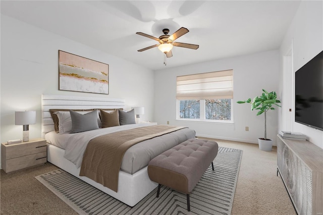 bedroom with carpet, baseboards, and a ceiling fan