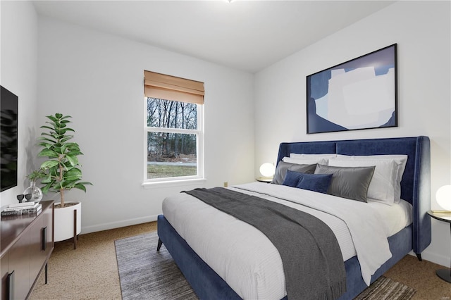 bedroom featuring carpet floors and baseboards