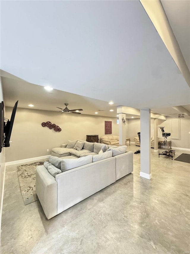 living room featuring recessed lighting, baseboards, finished concrete flooring, and a ceiling fan