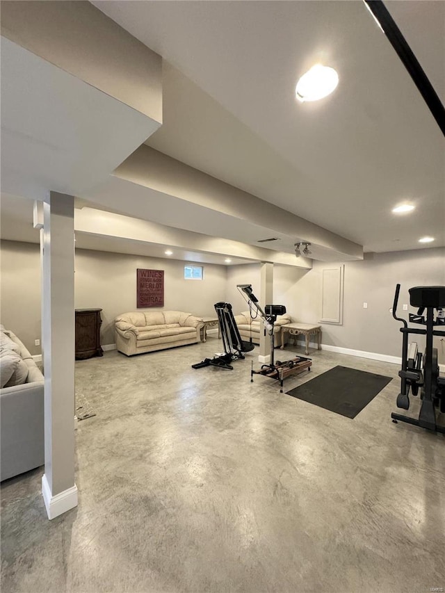 exercise room with recessed lighting and baseboards