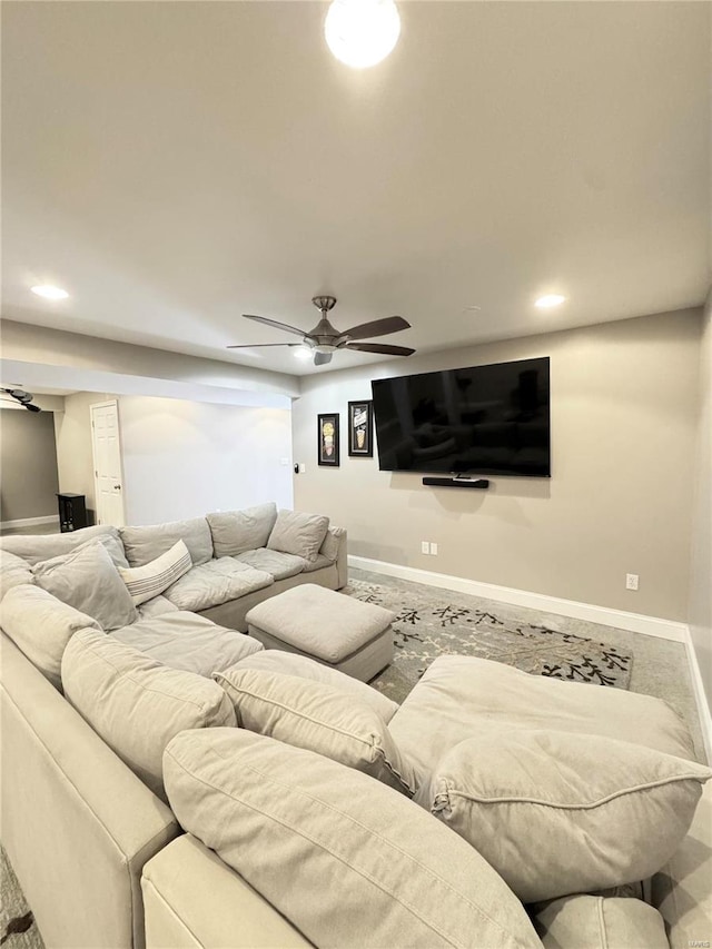 living area with recessed lighting, baseboards, and a ceiling fan