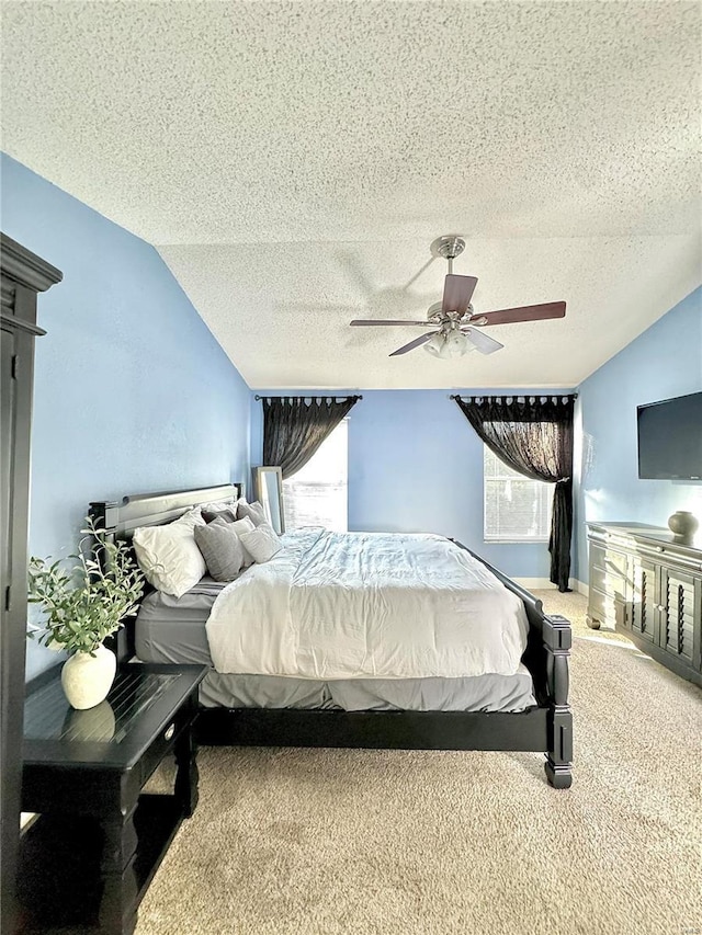 bedroom with multiple windows, carpet floors, and lofted ceiling