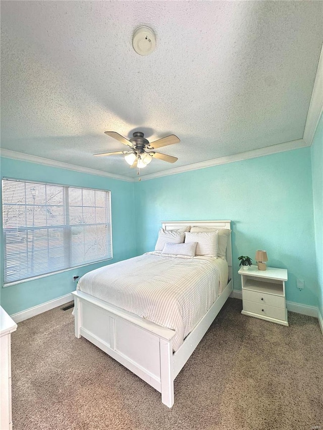 bedroom featuring a ceiling fan, crown molding, carpet, and a textured ceiling