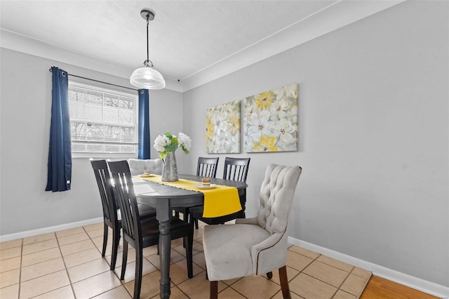 dining space featuring baseboards