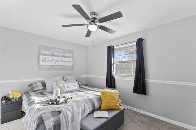 carpeted bedroom with baseboards and ceiling fan