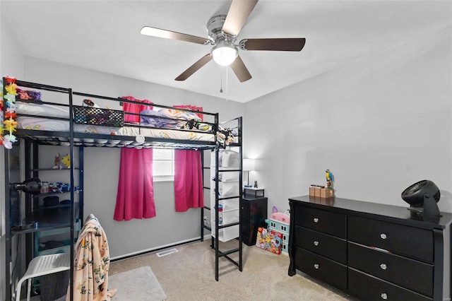 bedroom featuring visible vents, carpet, and a ceiling fan