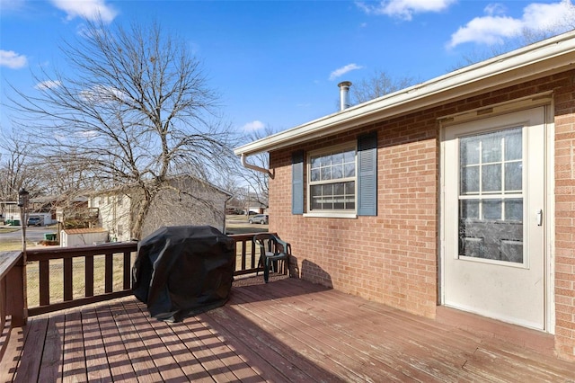 wooden terrace with grilling area