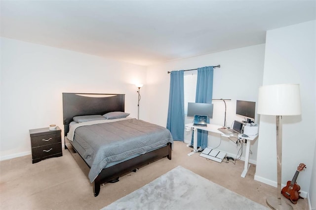 bedroom featuring carpet flooring and baseboards