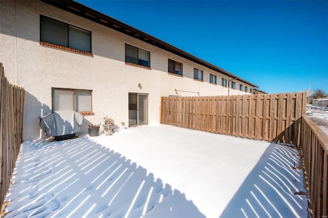 exterior space with fence and stucco siding