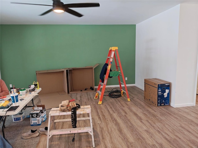 game room featuring ceiling fan, baseboards, and wood finished floors