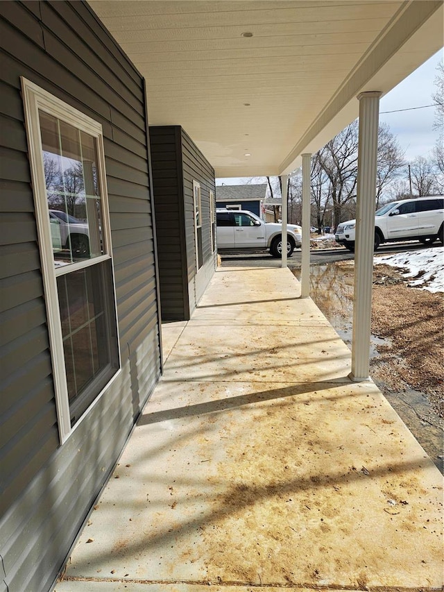 view of patio with covered porch and a carport