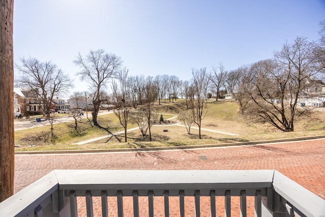 view of yard featuring a balcony