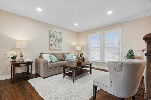 living room featuring recessed lighting, dark wood finished floors, and baseboards