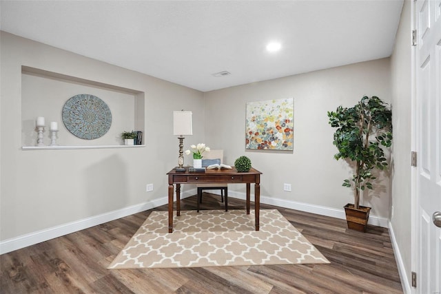 office space featuring baseboards, wood finished floors, and recessed lighting