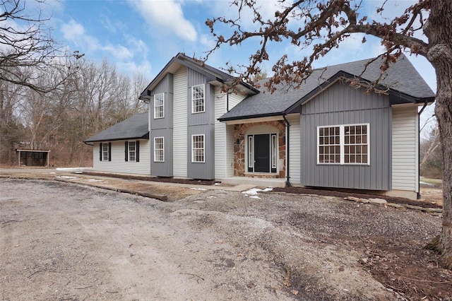 view of front of property with a shingled roof