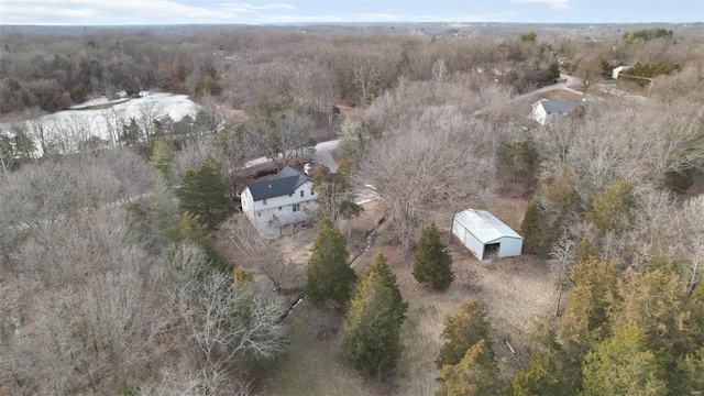 drone / aerial view featuring a forest view