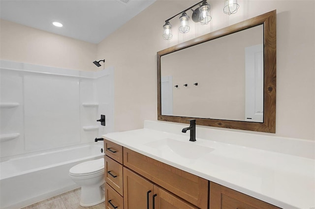 full bath with tub / shower combination, vanity, and toilet