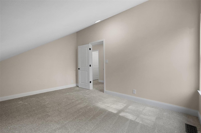 bonus room with carpet floors, visible vents, vaulted ceiling, and baseboards