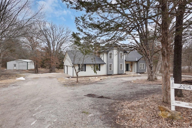 view of front facade featuring driveway and an attached garage