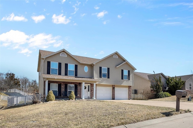 traditional-style house featuring concrete driveway, brick siding, fence, and an attached garage