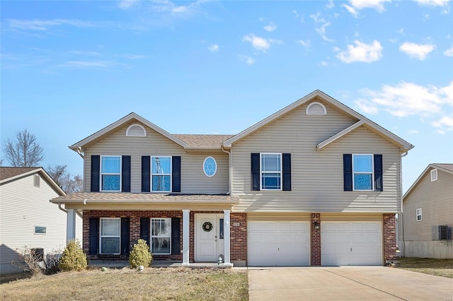 view of front of home with covered porch, brick siding, driveway, and an attached garage