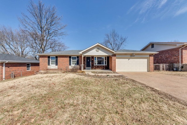 ranch-style house with a garage, fence, concrete driveway, and brick siding