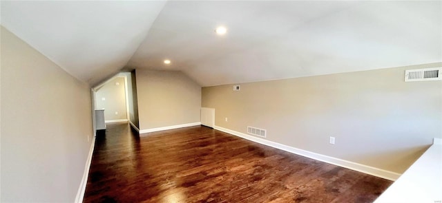 bonus room with vaulted ceiling, visible vents, and baseboards