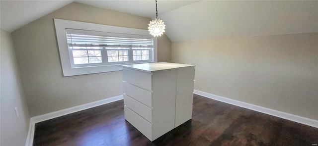 details with an inviting chandelier, baseboards, and wood finished floors