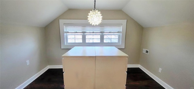 interior space with lofted ceiling and baseboards