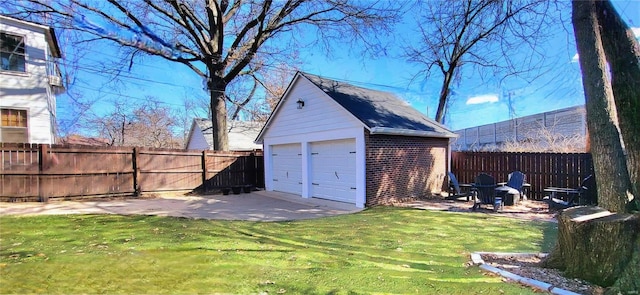 detached garage featuring fence