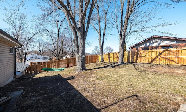 view of yard with a fenced backyard